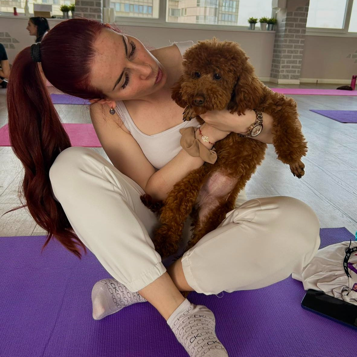 Puppy yoga class. Improve your health and relax with friendly puppies