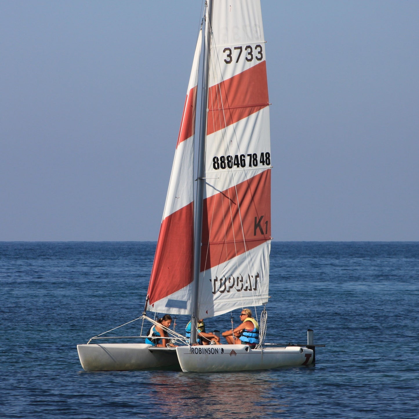 Romance for two on board of a sailing catamaran