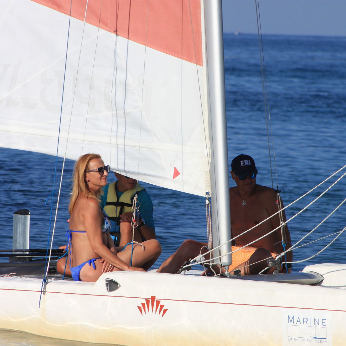 Romance for two on board of a sailing catamaran