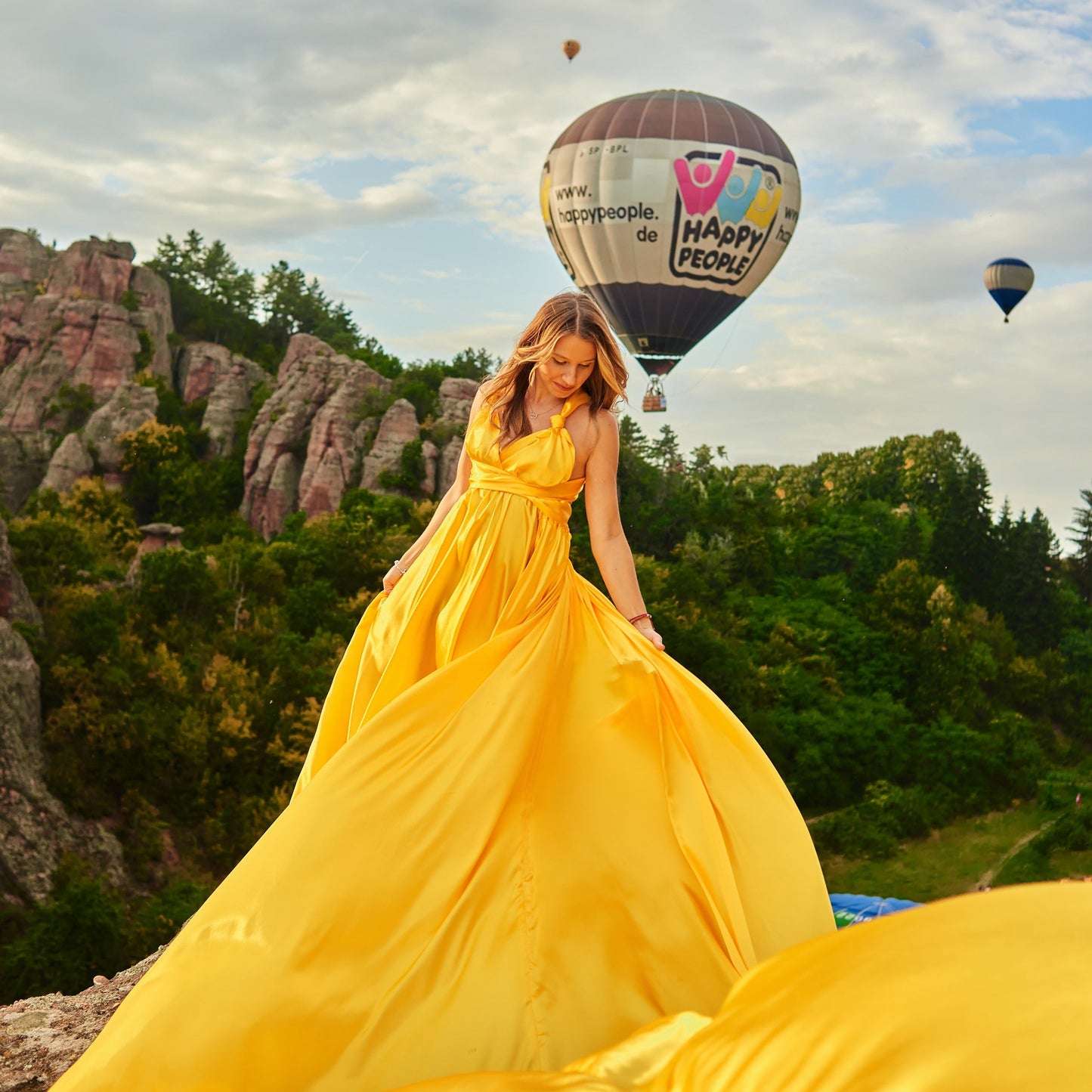 Flying dress photo shoot at the Belogradchik rocks