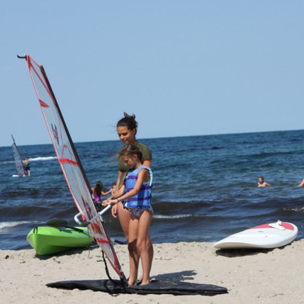 Surfing, kayaking, sailing or paddle board lessons and 2 nights for two by the sea. Camping Nestinarka