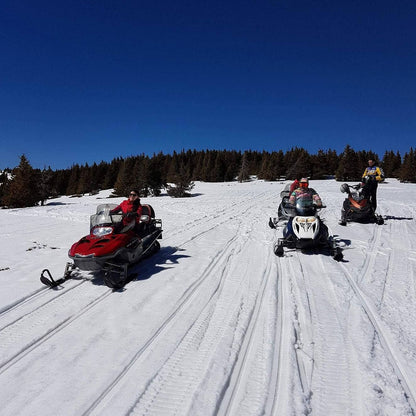 Adventure tour with snowmobiles
